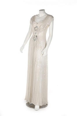 Lot 354 - A bespoke ivory sequinned evening gown, 1990s,...