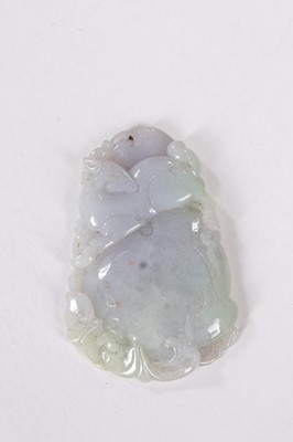 Lot 496 - A carved Jadeite pendant, Chinese, circa 1900,...