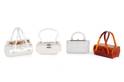 Lot 55 - Four Lucite handbags, 1950s, comprising coffin-...