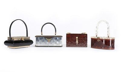 Lot 56 - Four Lucite handbags in dark shades, late...