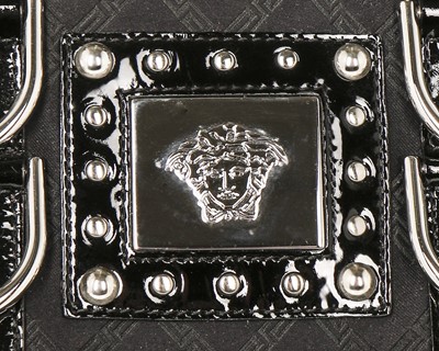 Lot 12 - A Versace 'Snap Out Of It' black patent...