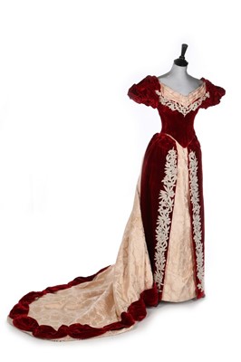 Lot 399 - A red plush and peach damask evening gown with...