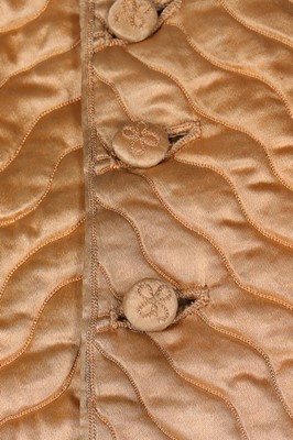 Lot 93 - Two waistcoats, one of quilted peach satin...