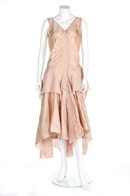 Lot 78 - A pink-gold shot taffeta cocktail gown,...