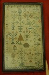 Lot 63 - A group of four samplers, including simple...