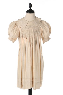 Lot 398 - A little girl's ecru raw silk 'farmer's smock',...