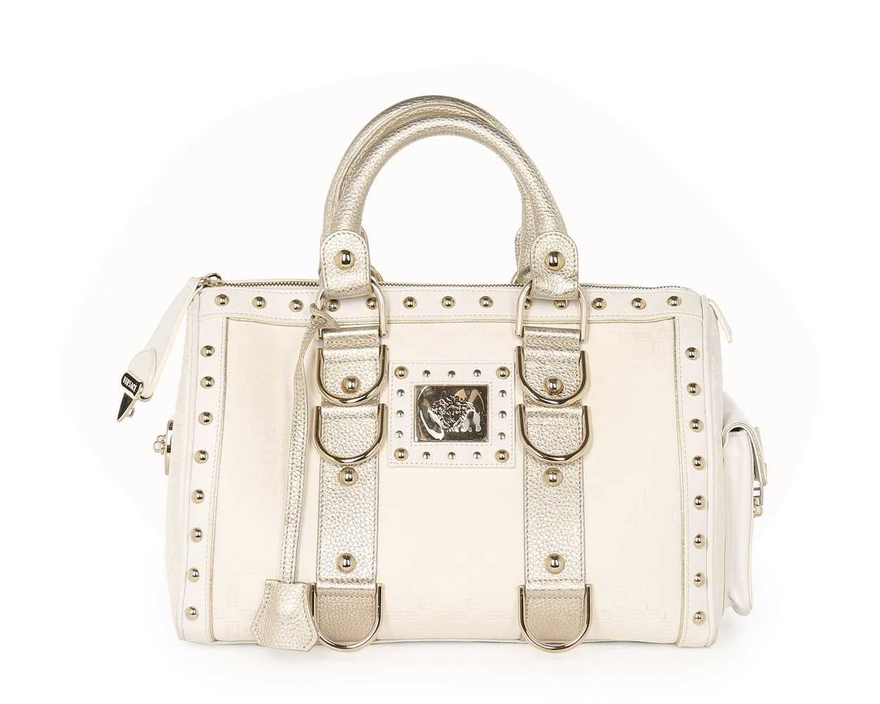 Lot 11 - A Versace 'Snap Out Of It' white and metallic...