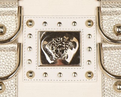 Lot 11 - A Versace 'Snap Out Of It' white and metallic...