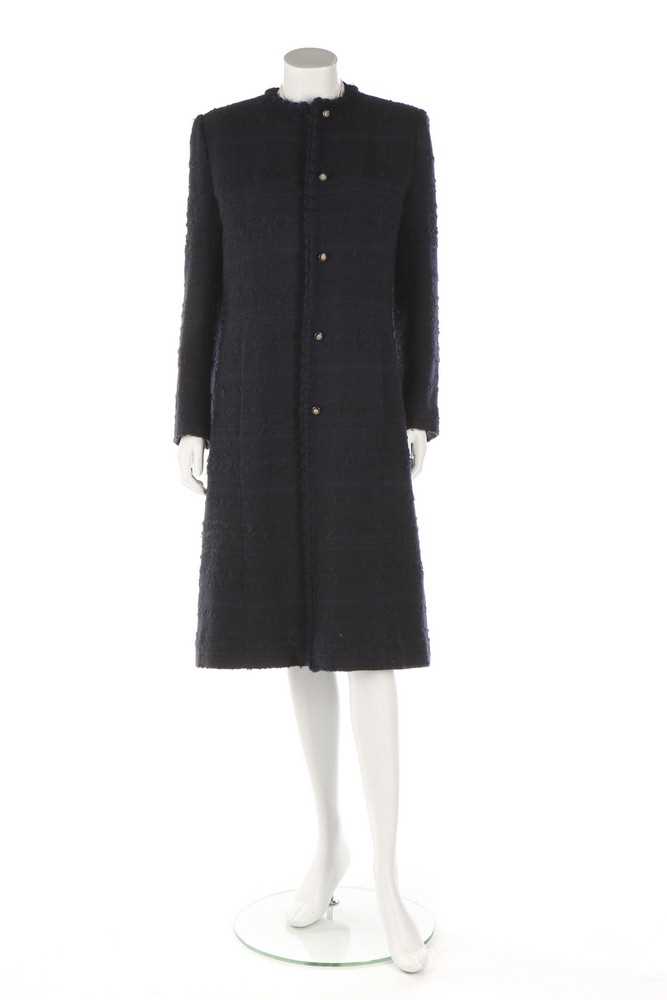 Lot 32 - A Chanel navy bouclé mid-length coat, 1990s,...