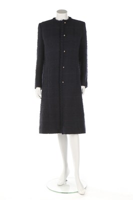 Lot 32 - A Chanel navy bouclé mid-length coat, 1990s,...
