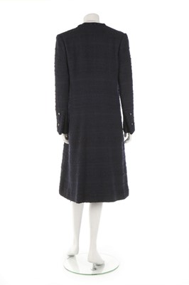Lot 32 - A Chanel navy bouclé mid-length coat, 1990s,...