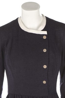 Lot 32 - A Chanel navy bouclé mid-length coat, 1990s,...