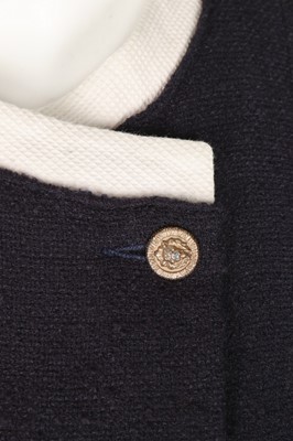 Lot 32 - A Chanel navy bouclé mid-length coat, 1990s,...