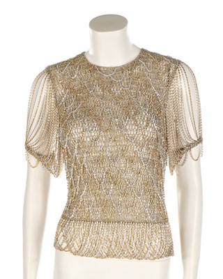 Lot 34 - A Loris Azzaro gold crochet and chain fringed...