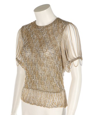 Lot 34 - A Loris Azzaro gold crochet and chain fringed...
