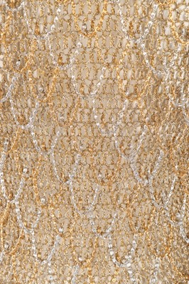 Lot 34 - A Loris Azzaro gold crochet and chain fringed...