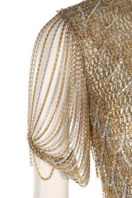 Lot 34 - A Loris Azzaro gold crochet and chain fringed...