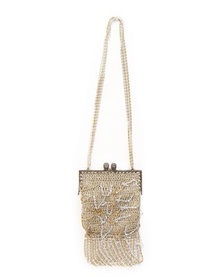 Lot 34 - A Loris Azzaro gold crochet and chain fringed...