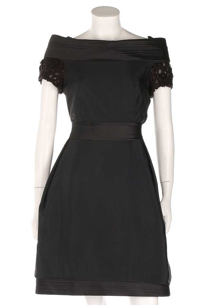 Lot 37 - A Versace black silk cocktail dress, late...