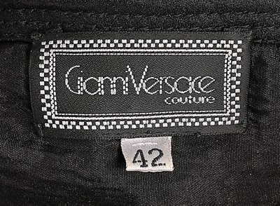Lot 37 - A Versace black silk cocktail dress, late...