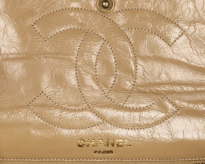 Lot 14 - A Chanel quilted beige leather handbag, 1980s,...
