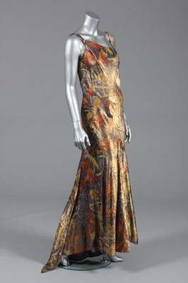 Lot 117 - A printed gold lamé bias cut evening gown,...
