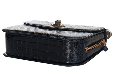 Lot 8 - A fine and rare Gucci ink-blue crocodile handbag with bamboo handle, 1960s