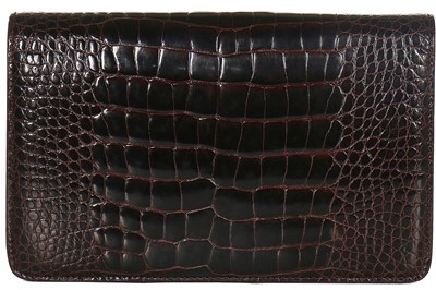 Lot 10 - A Gucci brown crocodile clutch bag with bamboo lift-clasp, early 1970s