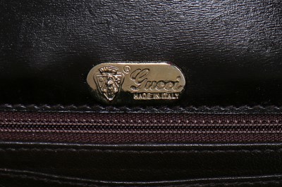 Lot 10 - A Gucci brown crocodile clutch bag with bamboo lift-clasp, early 1970s