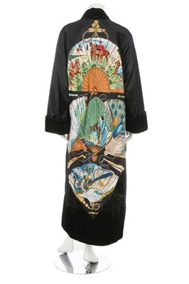 Lot 148 - An Hermès black satin evening coat/robe, 1990s,...