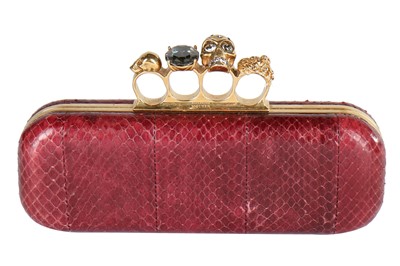 Lot 94 - Alexander McQueen by Sarah Burton burgundy snakeskin knuckle-duster clutch, 2011