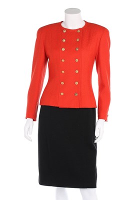 Lot 8 - A Chanel orange and black wool suit, early...