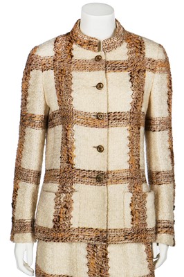 Lot 15 - A Chanel couture oatmeal and ivory tweed suit, 1969