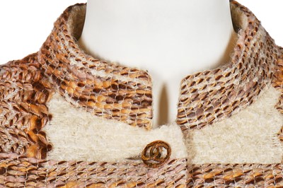 Lot 15 - A Chanel couture oatmeal and ivory tweed suit, 1969