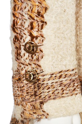 Lot 15 - A Chanel couture oatmeal and ivory tweed suit, 1969