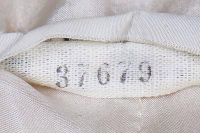 Lot 15 - A Chanel couture oatmeal and ivory tweed suit, 1969