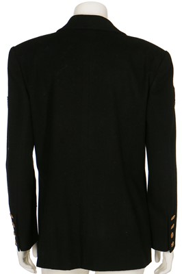 Lot 19 - A Chanel by Karl Lagerfeld black wool blazer covered with embroidered badges, A/W 1988-89