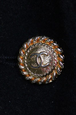 Lot 19 - A Chanel by Karl Lagerfeld black wool blazer covered with embroidered badges, A/W 1988-89