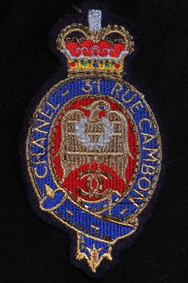 Lot 19 - A Chanel by Karl Lagerfeld black wool blazer covered with embroidered badges, A/W 1988-89