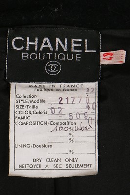 Lot 19 - A Chanel by Karl Lagerfeld black wool blazer covered with embroidered badges, A/W 1988-89