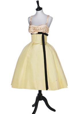 Lot 85 - A Balmain couture ivory satin cocktail dress, early 1960s
