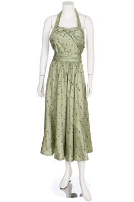 Lot 26 - A Violet Tatum crescent-moon-and-stars printed green silk gown, late 1930s