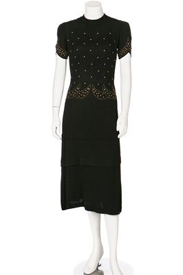 Lot 74 - Seven mainly black crêpe dinner dresses, 1940s