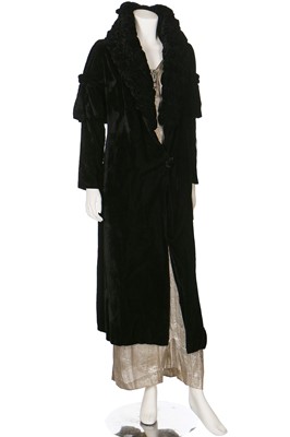 Lot 30 - A black velvet evening coat with Chinese embroidered skirt panel to lining, 1930