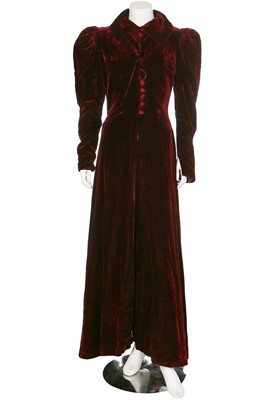 Lot 43 - A bordeaux velvet evening coat with leg-o-mutton sleeves, 1930s