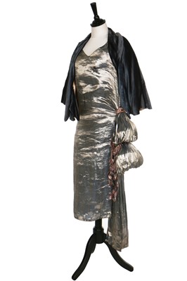 Lot 7 - A blue lamé dress with draped swags and cascading iridescent-pink petals to hip, 1920s