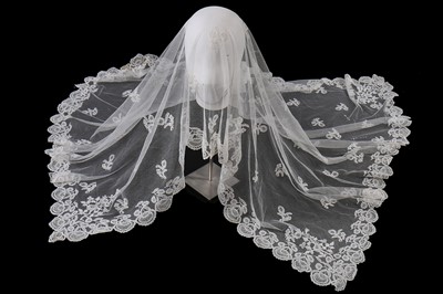 Lot 384 - A Honiton appliqué lace veil, 1830s and later remounted