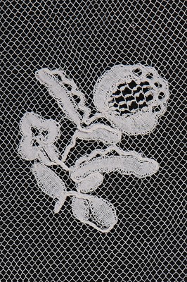 Lot 384 - A Honiton appliqué lace veil, 1830s and later remounted