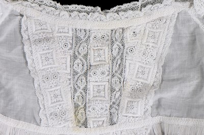 Lot 384 - A Honiton appliqué lace veil, 1830s and later remounted
