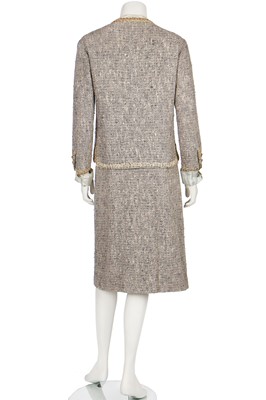 Lot 17 - A Chanel couture grey-pink tweed suit, 1960